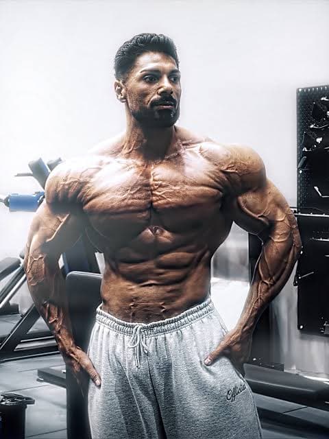 Athlete standing beside gym equipment
